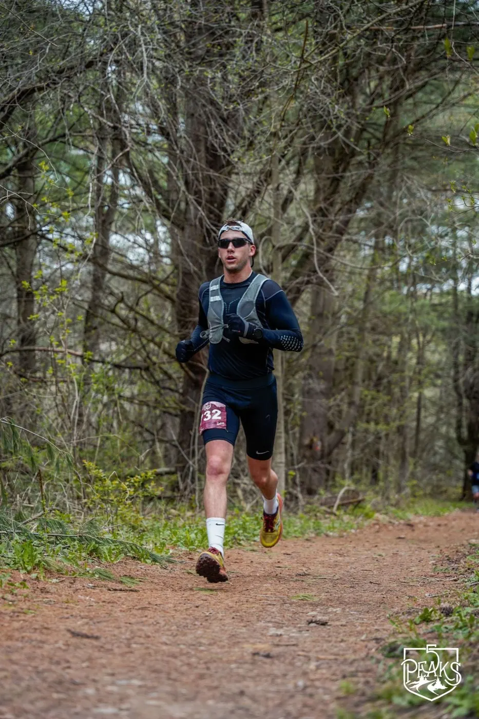 Shawn Scullion running a forest trail race
